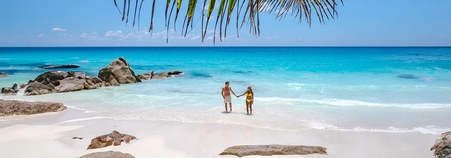 banner-warm-weather-beach-escapes-cancun-caribbean-and-beyond-1